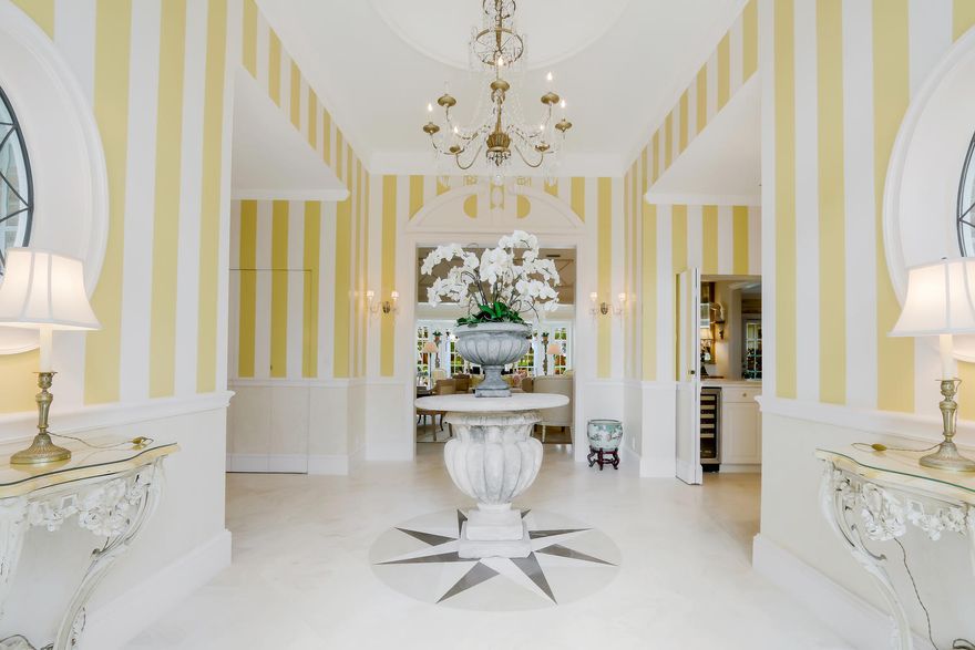 Classically designed home in the exclusive oceanfront community of Lost Tree Village situated on the golf course walking distance to the clubhouse. An entertainer's delight with formal living, dining and outdoor spaces that create settings for memorable gatherings.  The elegant entry and foyer open to volume ceilings and a view through the living room to the terrace and golf course beyond.  The terrace wraps around the pool to shady arbors creating multiple seating areas around the property. Professional landscaping and custom lighting enhance the outdoor experience.  The home has a new, expanded kitchen, expanded dining room, custom paint and designer accents. Offered unfurnished but furniture is negotiable.