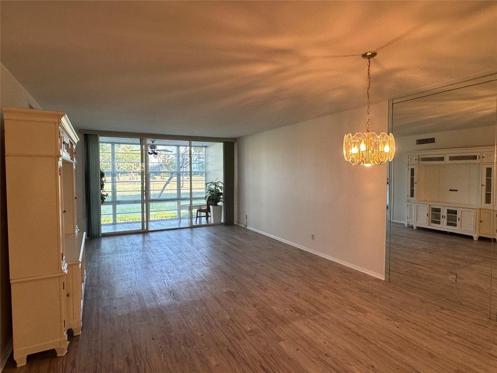 Photo of 3800 Oaks Clubhouse Drive #102, Pompano Beach, FL 33069 (MLS # F10479014)