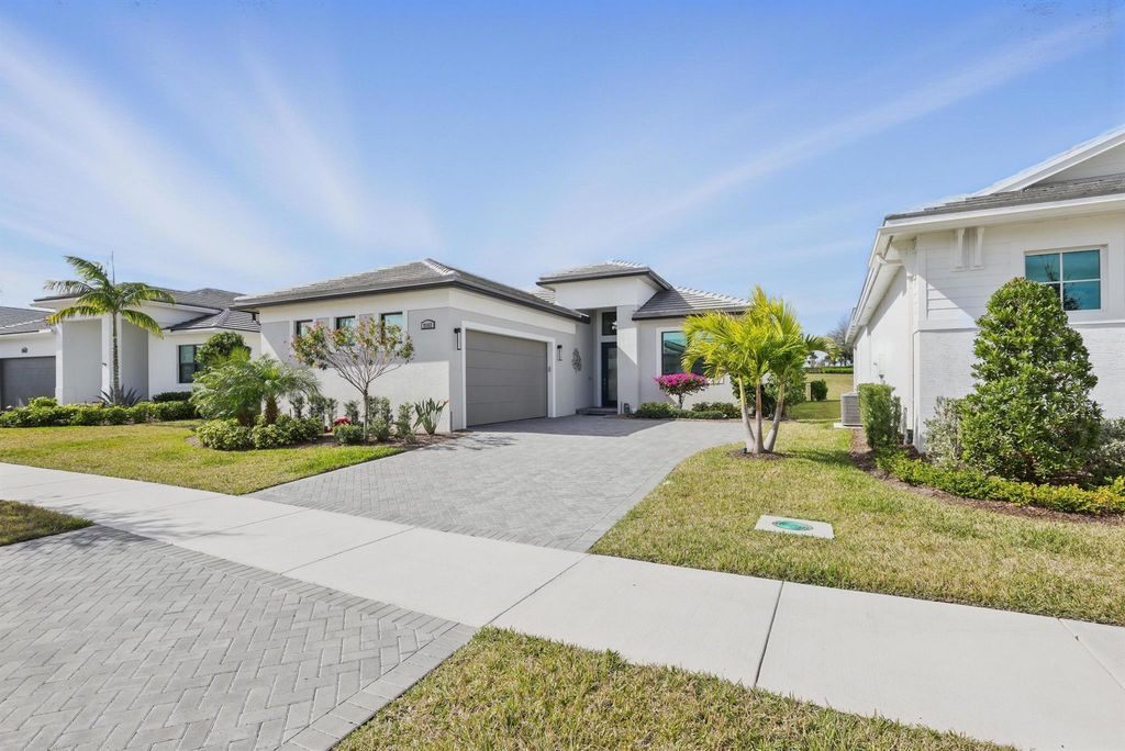 Photo of 9162 SW Arco Way, Port Saint Lucie, FL 34987 (MLS # R11121423)
