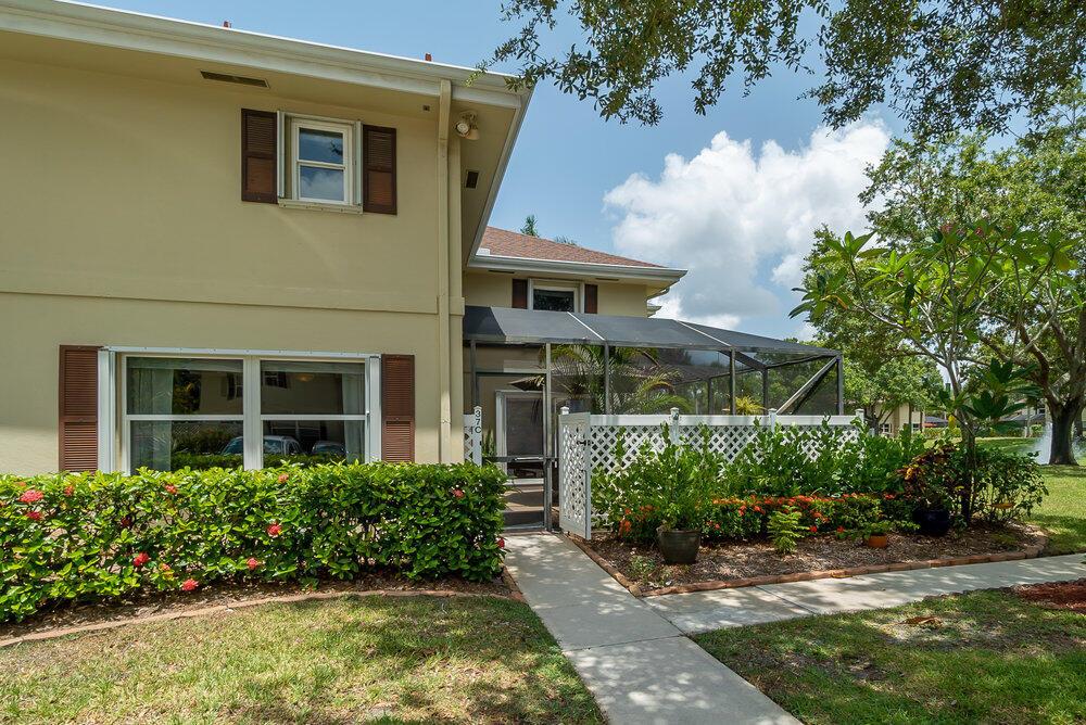 This luxurious lake view 2 bedroom/2.5 bath townhome is located in the highly desired Stamford at Royal Palm Beach. Lavishly remodeled with Custom kitchen cabinetry, Coffee bar, Stainless steel appliances, Granite countertops, Custom vanities, An elegant custom railing, New tile, and Premium hardwood flooring, Walk in closet, All new windows with hurricane shutters, double hung tilt-in windows for effortless cleaning. This exquisite home also features an alarm system, tankless water heater, water filtration system, and a new washer & dryer. You'll enjoy the beautiful lake view while relaxing after a long day in your screened in patio. The HOA includes outside insurance, Internet, community pool, landscaping & garbage service. Located near schools and shopping This stunning home won't last