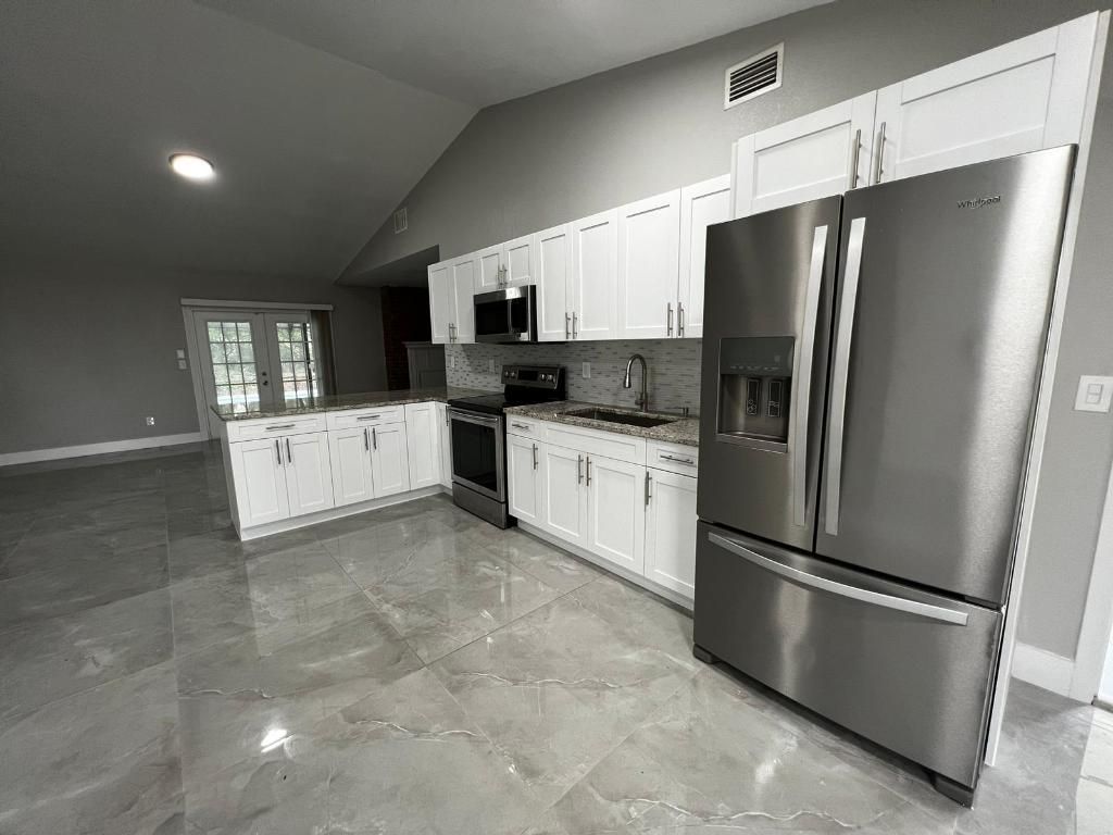 Photo of 1310 SW Bellevue Avenue, Port Saint Lucie, FL 34953 (MLS # R11157174)