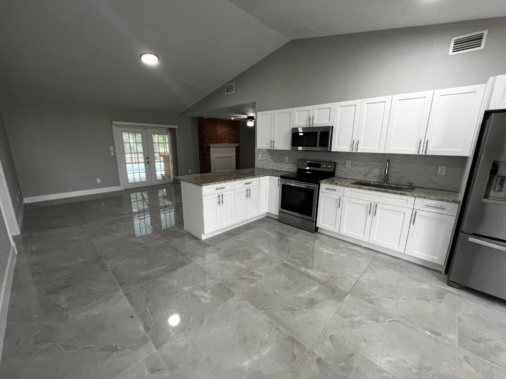 Photo of 1310 SW Bellevue Avenue, Port Saint Lucie, FL 34953 (MLS # R11157174)