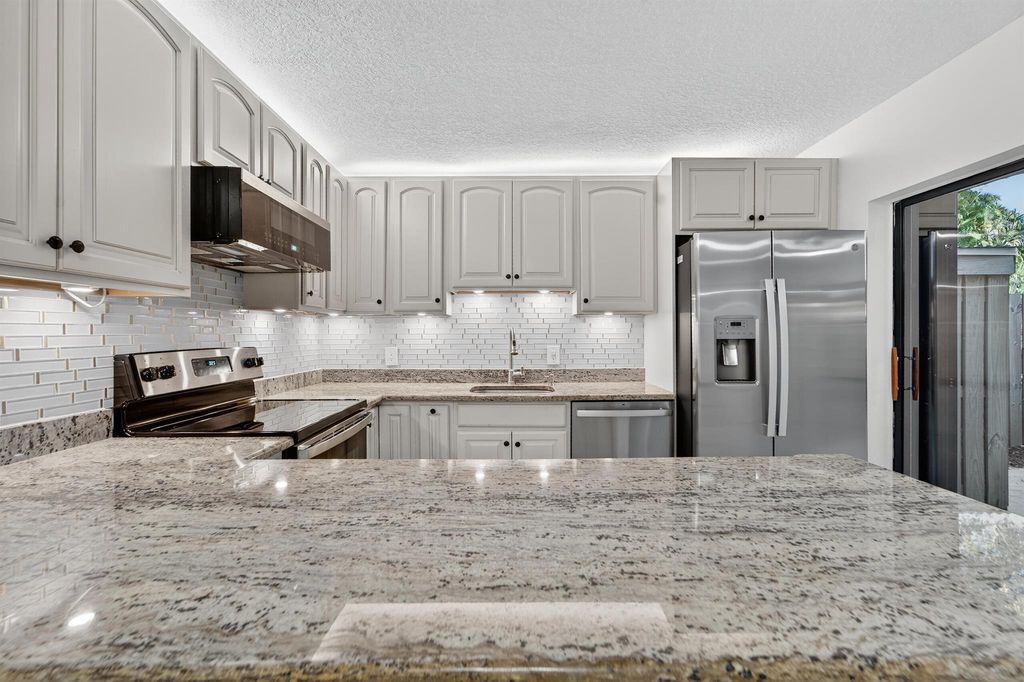 Photo of 1520 15th Lane, Palm Beach Gardens, FL 33418 (MLS # R11142228)