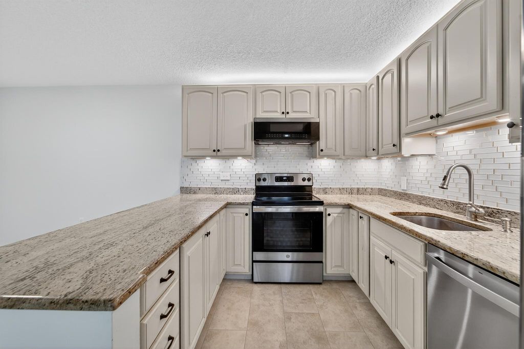 Photo of 1520 15th Lane, Palm Beach Gardens, FL 33418 (MLS # R11142228)