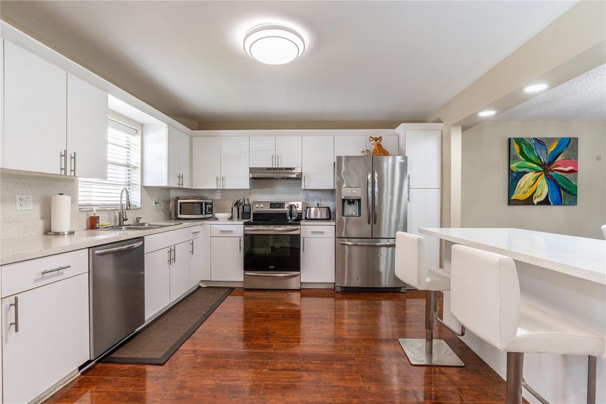 SPACIOUS FIRST FLOOR, 1,459 SF 2BR/2BA. Wide Open eat-in- kitchen featuring Quartz snack bar, Stainless Steel appliances; Full size side by side Washer/Dryer. Large walk in closets. Rich flooring throughout. Very comfortably furnished. Large wrap-around, screened patio off living room & master bedroom. Close to Tennis and Pool/BBQ area. FREE golf (except cart fees) on two 18 hole courses (PGA & Par3); Amenities include Restaurant, Billiard Room, Bbq/Picnic Area, Clubhouse, Courtesy Bus, Exercise Room, Heated Pool, Library, Putting Green, Sauna, Shuffleboard, Tennis, Pickle Ball, Vehicle Wash Area, Electric Car Charging Station.  Close to shopping, dining & highways.  15 minutes to the beach.  Active 55+ age required community.  BEAUTIFUL AND MOVE-IN READY!