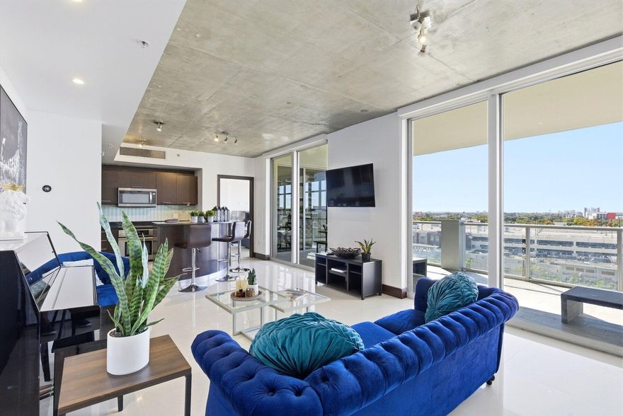 Exquisite FURNISHED 2BD/2BA residence in the heart of Midtown Miami offering some of the most breathtaking city views in the area. Designed with a dual master split layout, this sophisticated home features floor-to-ceiling glass in every room, 9-ft exposed concrete ceilings, elegant stone flooring, motorized blinds, and a custom chef's kitchen with dining island and designer finishes. An oversized private terrace with sleek glass railings creates the perfect indoor-outdoor living experience. Includes 1 parking space. 2Midtown delivers premier amenities including a resort-style pool, four hot tubs, state-of-the-art fitness center, steam room, sauna, and concierge service. Steps from Miami's finest dining, shopping, Wynwood & Design District.