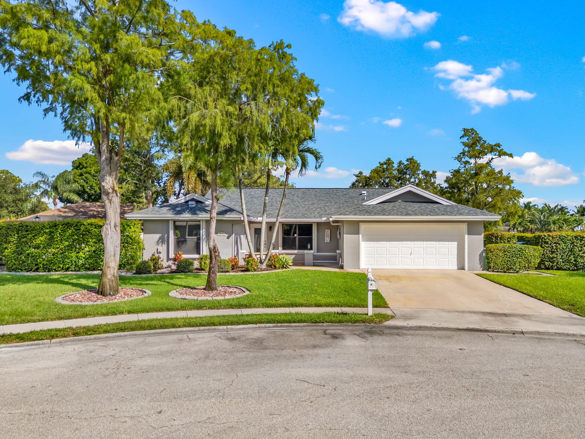 Beautifully 3-bedroom, 2-bathroom pool home, ideally located in the heart of Wellington. Just minutes from the Wellington International Equestrian Center, polo grounds, shopping, and dining, this home is the perfect seasonal retreat. Enjoy a spacious open floor plan, high ceilings, and a bright living area that flows seamlessly into the updated kitchen with stainless steel appliances and granite countertops. The primary suite features a walk-in closet and private en-suite bath. Additional bedrooms are comfortable and well-appointed for family or guests. Step outside to your private backyard oasis with a pool and a screened-in patio, perfect for entertaining or relaxing after a day at the showgrounds. The home also includes a 2-car garage, in-unit laundry, and plenty of storage.