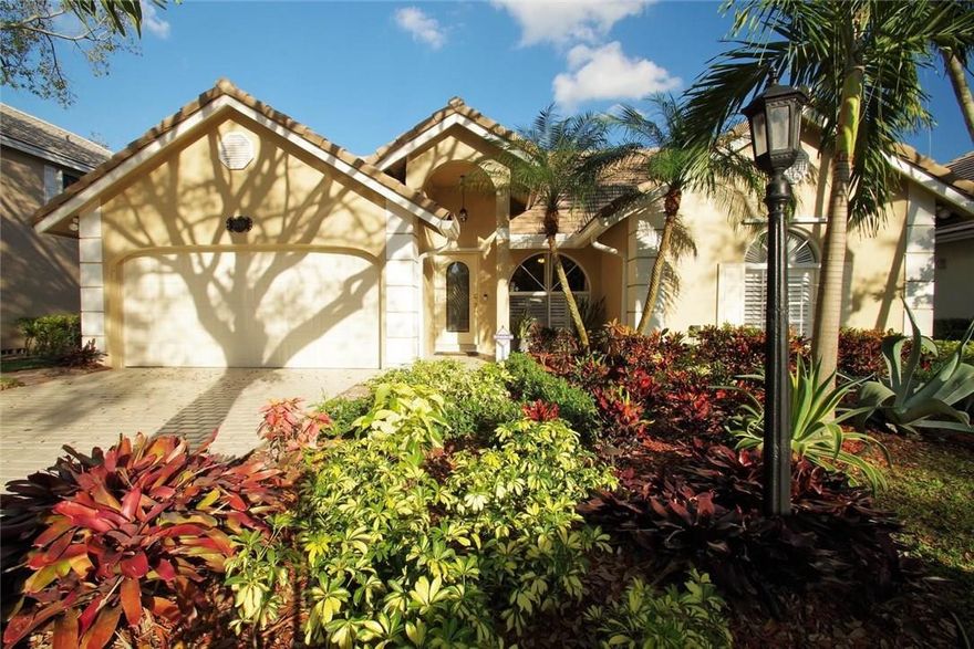 Welcome to this beautiful 1 story home located in the highly sought-after golf community of Eagle Trace! This home features loads of updates & includes vaulted ceiling, open kitchen with island, wood floors, master bedroom with walk-in closet, split bedrooms, formal dining room, separate family room w/wine rack/built-in shelves! Spacious screened patio enclosure, pavered walkway around the house, hurricane panels & 2 car attached garage. The clubhouse offers a pool, tennis courts & much so more!