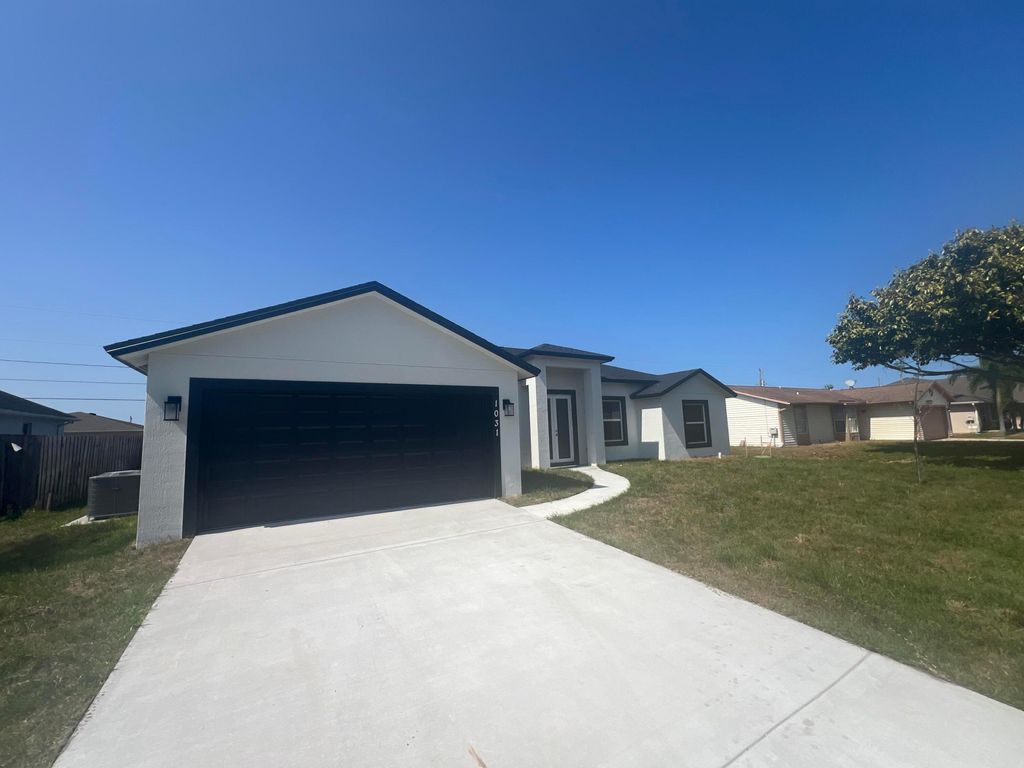 Photo of 1031 SW Du Bois Ave, Port Saint Lucie, FL 34953 (MLS # B26001042)