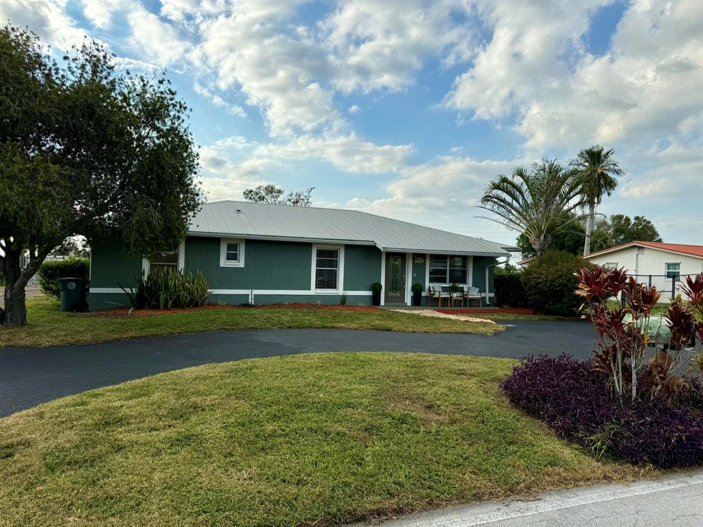 Photo of 1240 Stillwell Road, Belle Glade, FL 33430 (MLS # R11142065)