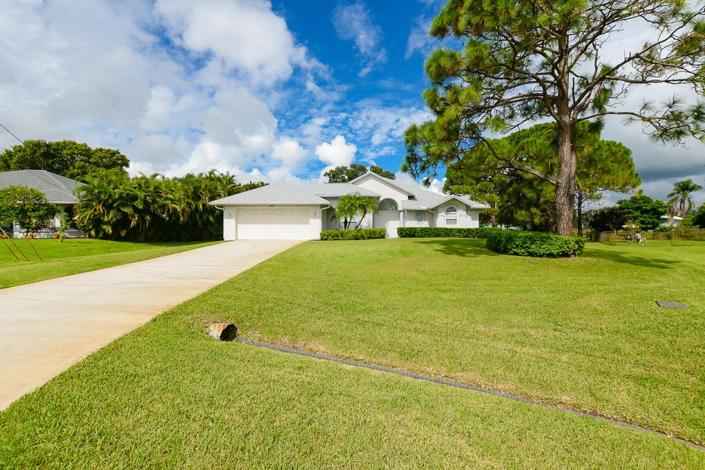 Photo of 311 SE Fisk Road, Port Saint Lucie, FL 34984 (MLS # R11123544)