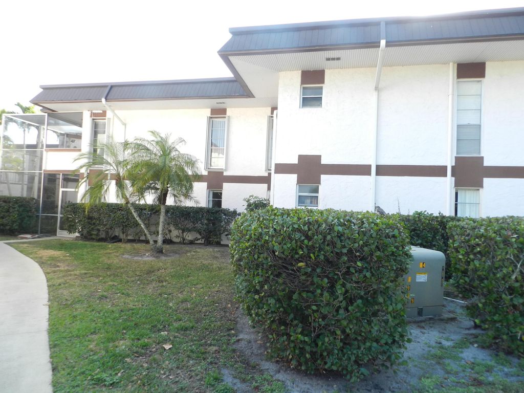 Photo of 4 Greenway Village N Vlg N #107, Royal Palm Beach, FL 33411 (MLS # R11165359)