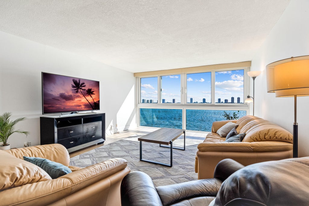 Photo of 301 Lake Shore Drive #702, Lake Park, FL 33403 (MLS # B26094688)