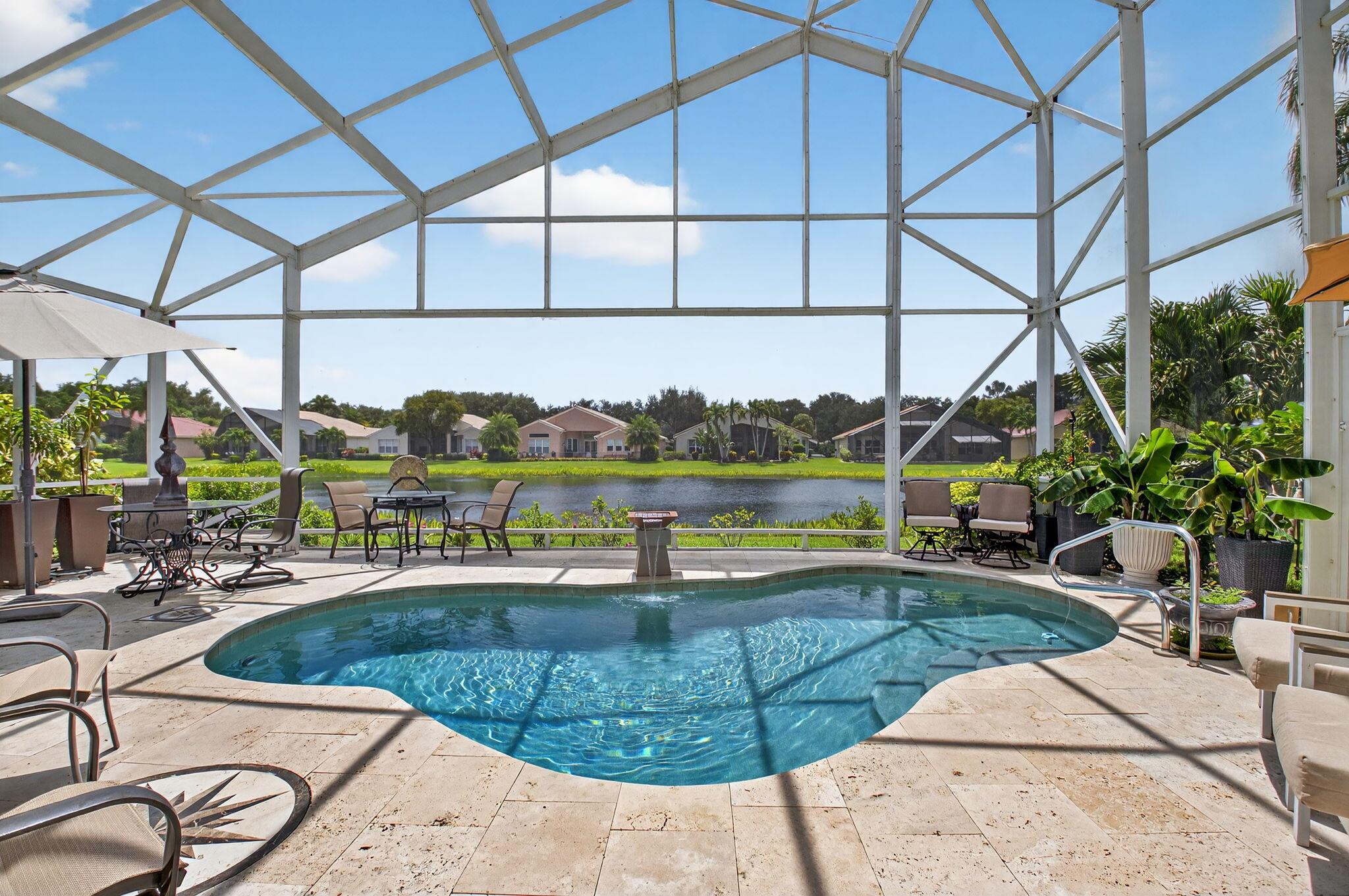 SPECTACULAR MADRID MODEL WITH 4 BEDROOMS, 2.5 BATHS, ON THE LAKE WITH SALT WATER, HEATED POOL WITH HUGE NEW SCREEN ENCLOSURE. TRAVERTINE TILE SURROUNDING THE POOL. THIS DESIGNER'S HOME IS GORGEOUS!! BEAUTIFUL PORCELAIN TILE FLOORS AS YOU ENTER WHICH EXTENDS INTO MOST LIVING AREAS. KITCHEN HAS NEWER SS APPLIANCES, GAS COOKTOP, DOUBLE OVENS, DISHWASHER, REFRIGERATOR & WATERFALL GRANITE COUNTERTOPS. WHOLE HOUSE GENERATOR. BEAUTIFULLY UPDATED MASTER BATH WITH NEW CABINETS, WATERFALL QUARTZ COUNTERTOPS AND TONS OF STORAGE. TWO WALK-IN CLOSETS. COME TO THE OPEN HOUSE SUNDAY JULY 27 AT 12 NOON! NEWLY RENOVATED CLUBHOUSE COMING SOON WITH SPECTACULAR EXPANDED FITNESS CENTER AND CAFE. ALL MEASUREMENTS AND INFORMATION DEEMED ACCURATE AND SHOULD BE INDEPENDENTLY VERIFIED.