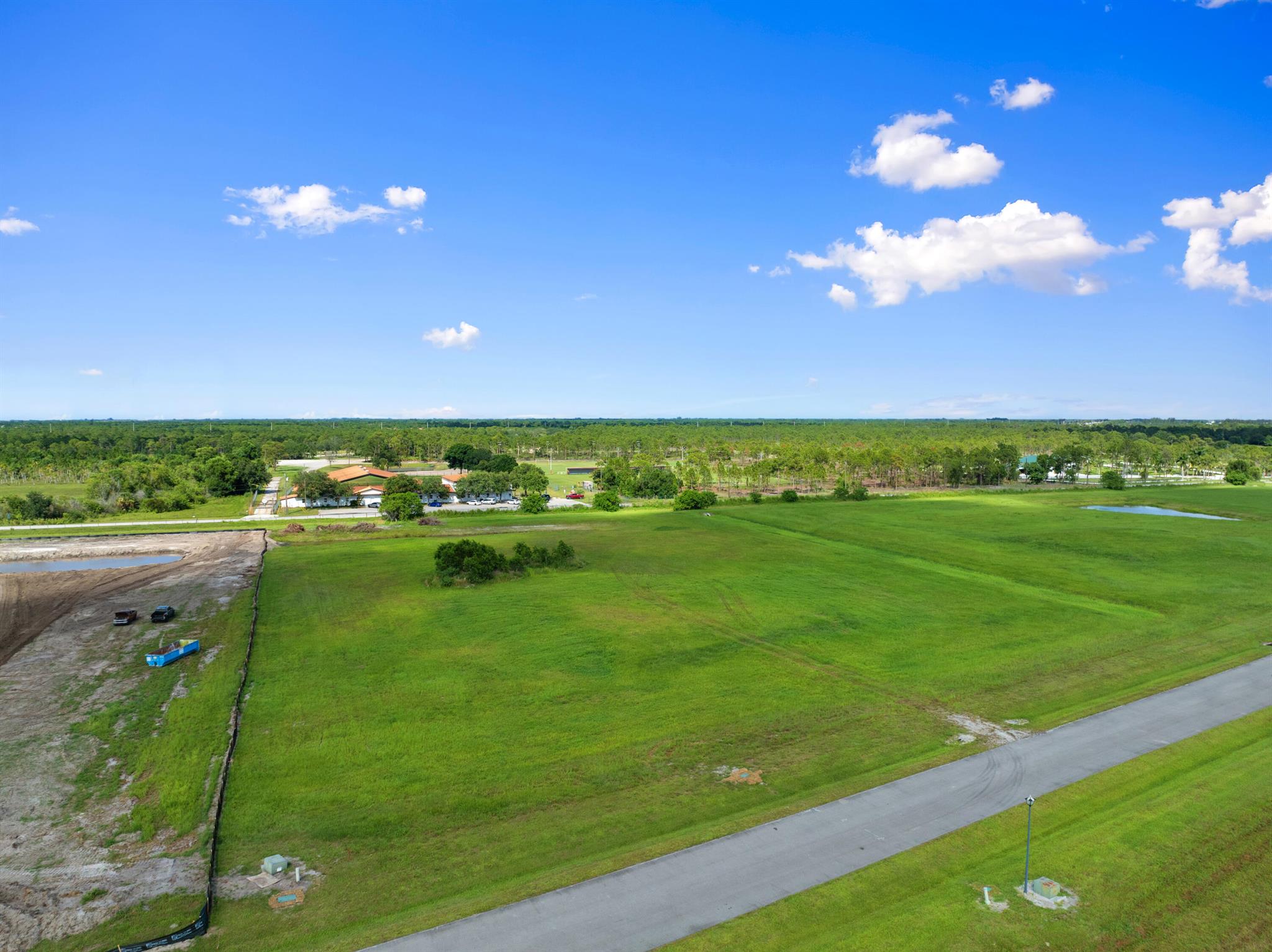 5+ acres cleared lot with culvert to property with added fill for house pad & small pond. This site is cleared & filled with approximately 100 additional loads of dirt, ready for you to build your custom dream home. Situated in Palm City Farms Meadow Run - Fox Grove featuring 90 home sites with multimillion dollar custom homes inside gated community offing paved roads & underground electric. This is an Equine friendly neighborhood with deeded bridle trails for your horses. No other farm animals allowed. Located just off of Citrus Blvd 1.5Miles South of 714. Easy access to I-95 & Turnpike.