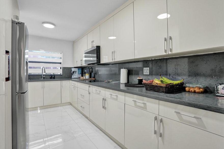 Beautifully updated 3-bedroom, 2.5-bath townhouse in a highly desirable Pembroke Pines community. This well-maintained home offers a spacious, functional layout with tile flooring throughout, a fully remodeled kitchen and modern bathrooms, and custom closet built-ins that enhance both style and storage. Enjoy abundant natural light and serene lake views that create a private, peaceful setting ideal for relaxing or entertaining. Features include quality appliances and an energy-efficient tankless water heater. Conveniently located just minutes from the Seminole Hard Rock Hotel & Casino, major highways, top-rated shopping, dining, and entertainment. Perfect for families, professionals, or investors seeking comfort, style, and location.