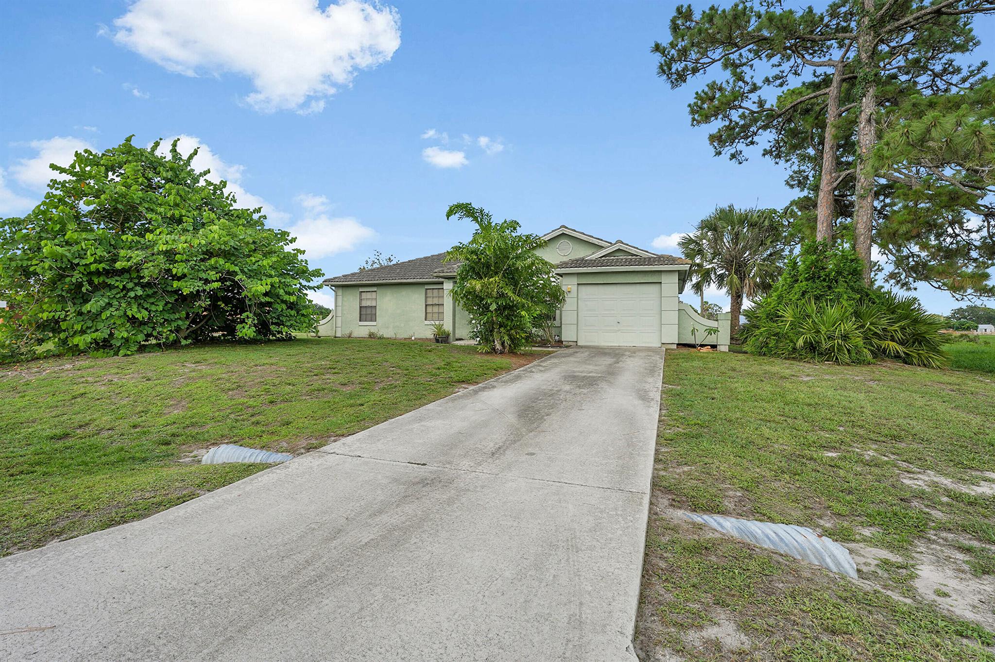 Cozy 3-bedroom, 2-bathroom home on a large private corner lot over looking a serene lake, busy with beautiful wildlife and fishing right out your back door! Quiet neighborhood with only 2 close neighbors. Nothing can be built next door or behind you! Everything you need within walking distance. Entertainment and Tradition less than 10 minutes away! Right between 95 and the turnpike making a commute easy! Water heater replaced in 2024. AC replaced in 2022. Don't miss this opportunity!