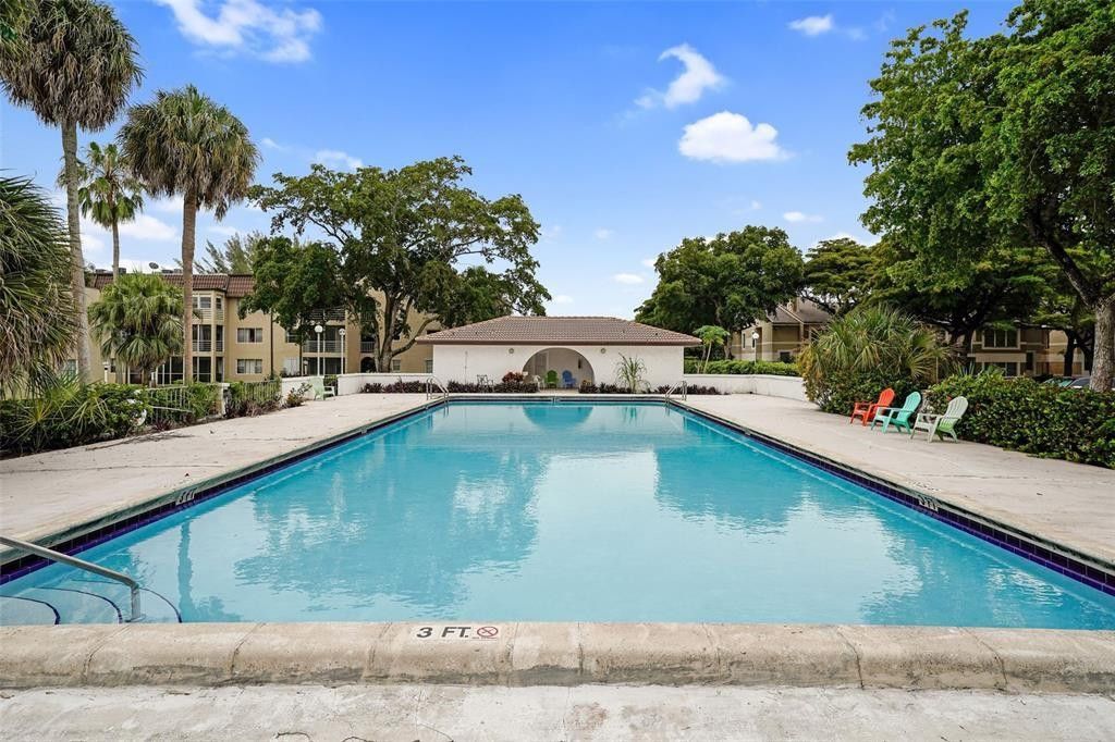 Photo of 2710 Riverside Drive #106-A, Coral Springs, FL 33065 (MLS # F10555512)