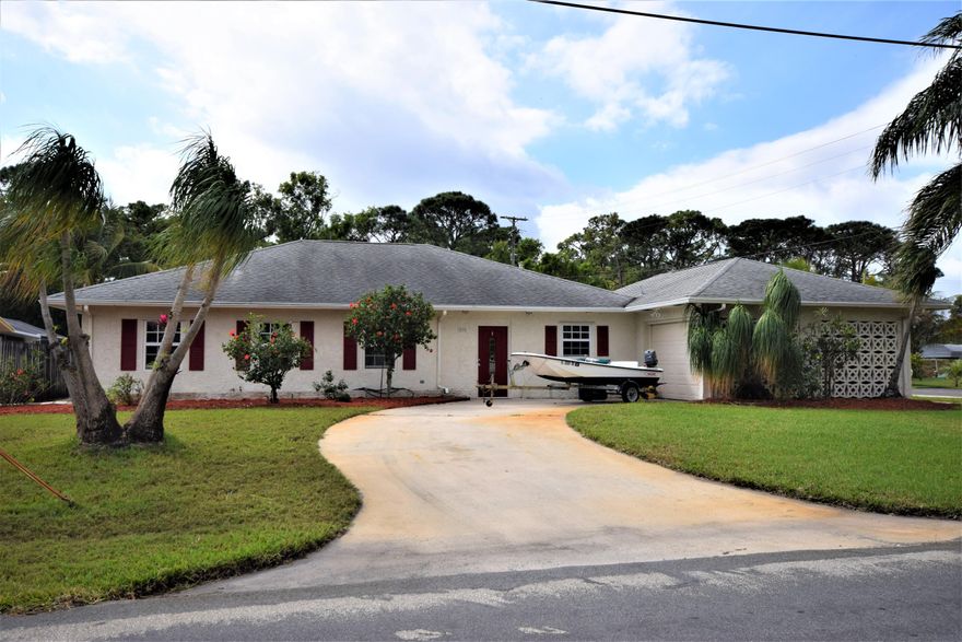 A great waterfront home in Golfview Harbour! 3/2 corner lot just adjacent to a fabulous public park! This home features an oversize two car garage, 3 driveways, and concrete slab perfect for boat parking. Great outdoor living space complete with covered and screened patio and swimming pool overlooking the canal. This home has tile throughout and an open concept floor plan. Roomy kitchen with white cabinets, pantry, and granite counter tops. Very large master suite with huge walk in closet, and on suite bath with double vanities. Minutes from beaches, Atlantic Ave, and I95!