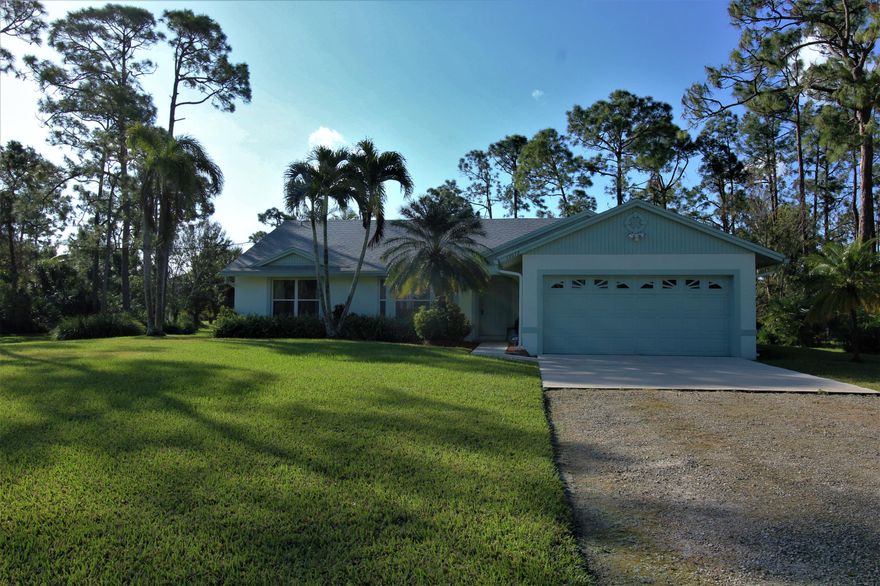 Beautiful pool home, open & bright with split floor plan featuring 3 bedrooms, 2 baths, 2 car garage & tons of upgrades! Enjoy peace of mind with the newer roof, energy efficient A/C & refrigerator, updated bathrooms, freshly painted interior w/warm colors inside & out, security pool gate, & existing Home Security System. Enjoy the elegance of Granite counters, Stainless Steel appliances, Kinetico Water System, new carpeting in bedrooms & sliding glass doors leading to pool. There is plenty of storage with separate Laundry Room (w/newer dryer), 2 car garage & large attic. Keep the yard lush with a separate well for the sprinkler system. Relax by the screened in pool all year long & enjoy the serene landscape with mature Pine Trees covering the lot. Home is move in ready so bring your fussiest buyers! Property is 1 block from paved road (Avocado) & close to Major Shopping Centers.