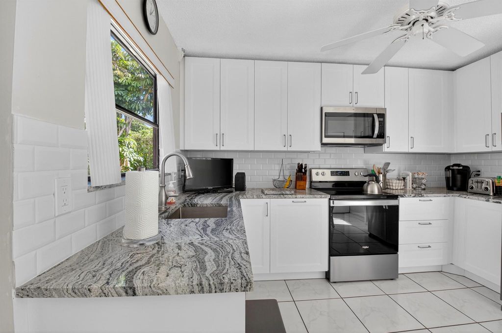 Photo of 1301 NW 23rd Lane, Delray Beach, FL 33445 (MLS # R11134185)