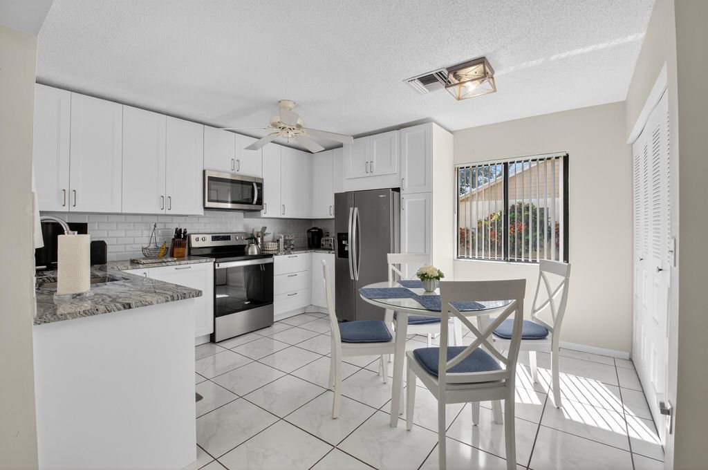 Photo of 1301 NW 23rd Lane, Delray Beach, FL 33445 (MLS # R11134185)