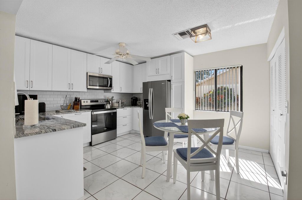Photo of 1301 NW 23rd Lane, Delray Beach, FL 33445 (MLS # R11134185)