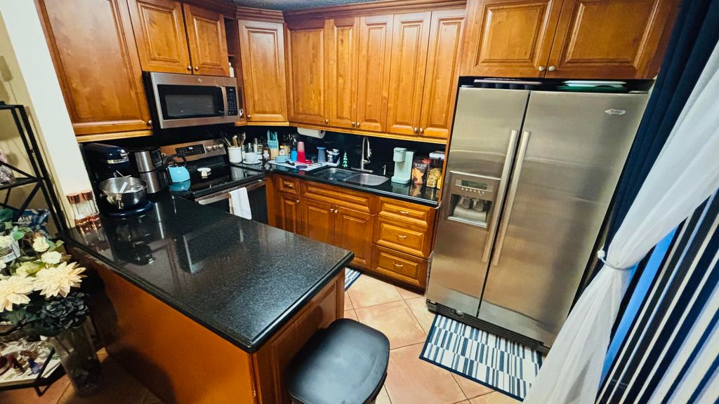 Photo of 245 Woodland Road, Palm Springs, FL 33461 (MLS # B26022568)