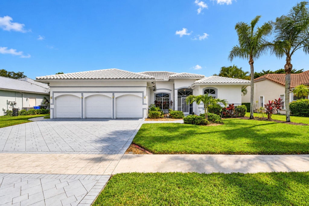 Photo of 6548 ROCK CREEK Drive, Lake Worth, FL 33467 (MLS # B26089219)
