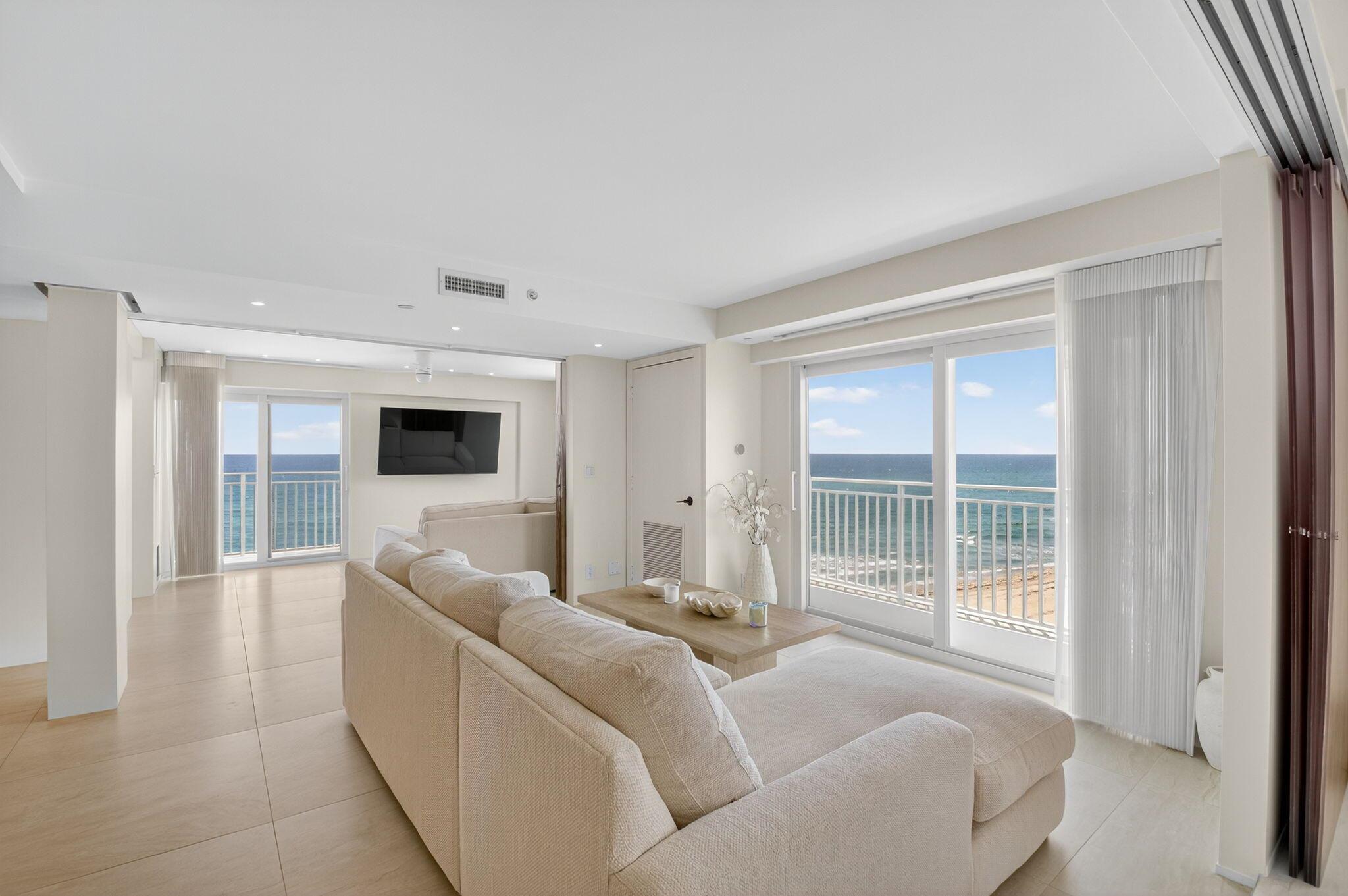 Coastal Luxury Living Redefined. Situated directly on the oceanfront, Residence 507 offers sophisticated living with uninterrupted ocean views from every room, including the primary bath. This fully integrated smart home captures the essence of coastal elegance, with two private balconies perfectly positioned for sunrise and sunset.The custom kitchen is the true centerpiece, designed for both function and entertaining, and appointed with Miele, Bosch, and Sub-Zero appliances, bespoke wood cabinetry, and an oversized island with seating for ten. Floor-to-ceiling glass doors frame the living space, creating a seamless connection between polished interiors and the breathtaking beauty of the ocean.