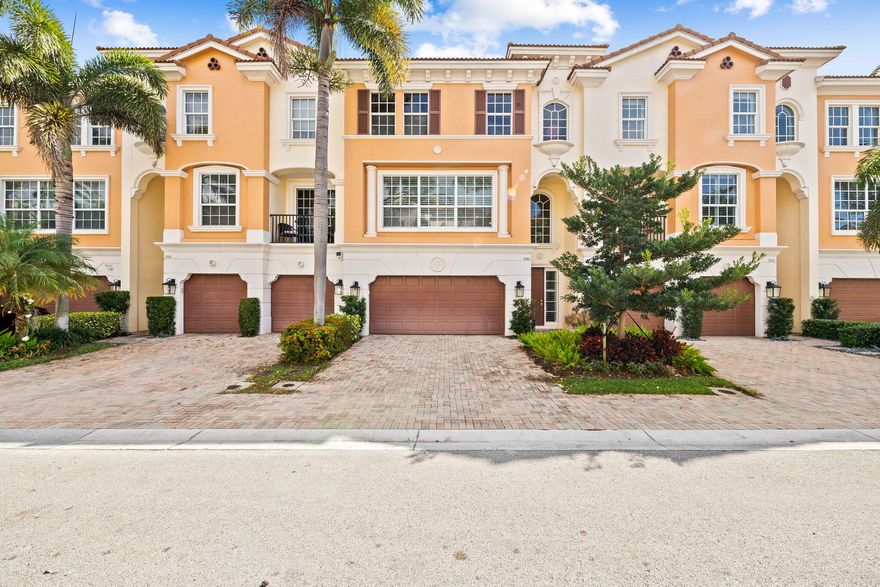 Welcome to this beautifully appointed, modified Bellavita model 3-story townhouse with a private elevator for added convenience that provides access to all levels. Located in the gated community of Trieste in East Boca Raton, this residence is ideally located just minutes from Mizner Park, Atlantic Avenue, I-95, and the best shopping, dining, and entertainment the area has to offer. This residence offers 4 bedrooms and 3.5 bathrooms. The home features impact windows and doors along with tasteful updates throughout, offering both style and peace of mind. The second floor serves as the main living area, featuring an open layout with a spacious living room, dining area, and well-appointed kitchen, perfect for everyday living and entertaining. The first floor includes a private bedroom and an additional living area, ideal for guests, a home office, or a flexible living space. The third floor features the primary suite, along with two additional bedrooms, a full bathroom, and the laundry room. Enjoy outdoor living on your private patio with both covered and open areas, complete with a built-in grill and sink, perfect for entertaining or relaxing outdoors. Residents of Trieste enjoy a gated community setting with a community pool, all while being close to everything that makes East Boca living so desirable.