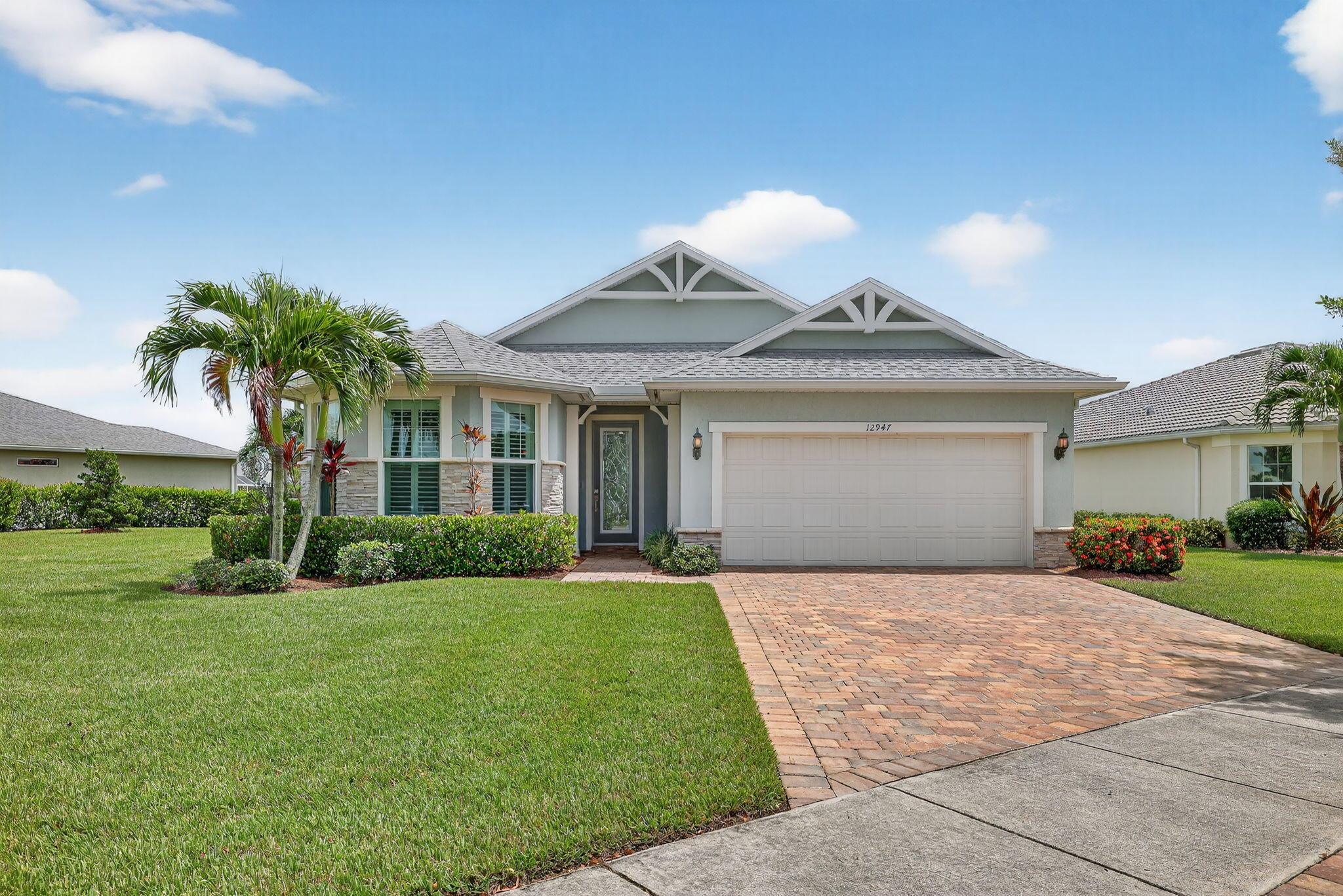 Come see this stunning waterfront home on an oversized corner lot in the highly sought-after Del Webb Tradition 55+ community!This 3-bedroom, 2-bath, 2-car garage residence offers an open and inviting layout with hurricane-impact glass windows throughout.Enjoy peace of mind with a new water heater, a full-home water filtration system, and a screened-in lanai perfect for relaxing while taking in the serene water views. The spacious master suite features a large walk-in closet, while the home also includes a generous laundry room and a separate linen room for added storage.Nestled in a gated community, you'll have access to exceptional amenities and a vibrant lifestyle, all while enjoying the privacy of your oversized lot.