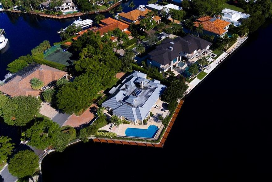 Gorgeous One level living in this Bay Colony Stunner! Tastefully RENOVATED for the most discriminating Buyers.Fabulous Open Chefs Kitchen with top of the line appliances flowing into a one of a kind sky lit great room whereNano doors open to a large loggia leading to a resort style pool area. Take your pick between 2 Master Suites asthis split plan is perfect for any size family and with over 200ft of dockage and a protected turning basin LARGEYACHTS R welcome Bay Colony is 24 hour Armed Guard Gated!