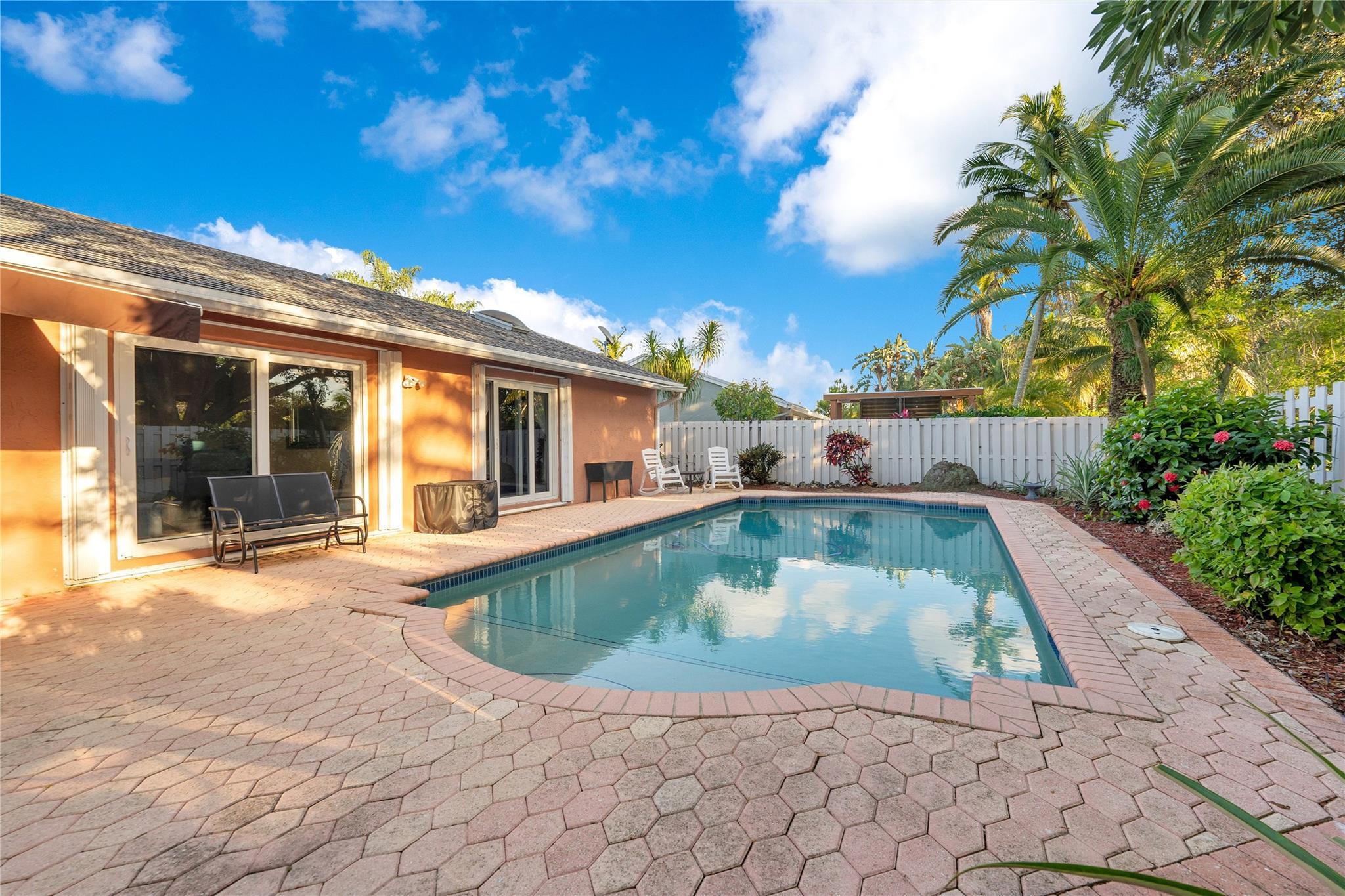 BUYER FINANCING FELL THROUGH. SELLER MOTIVATED- Experience the charm of this stunning 4-bedroom, 2-bathroom home in the sought-after Shenandoah community. Nestled in the estate section, it offers a private backyard oasis backing up to Acre homes, with a separate play area for kids. Conveniently located off 595 and 75, enjoy easy commutes and quick access to Miami, Fort Lauderdale, and local events. Recent upgrades include a new roof and gutter system (2025), hurricane impact windows, doors, and skylight (2024), and elegant French and sliding glass doors leading to the pool area.
The in-ground pool features new equipment and a salt chlorination system (2024), with an upgraded electric panel (2023).
Seize the opportunity to make this gem your new home, where luxury meets convenience.