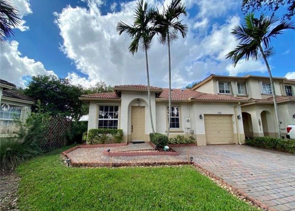 Photo of 1828 NW 79TH Way NW, Pembroke Pines, FL 33024 (MLS # B26067989)