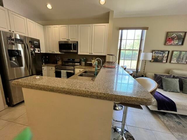 Photo of 1828 NW 79TH Way NW, Pembroke Pines, FL 33024 (MLS # B26067989)
