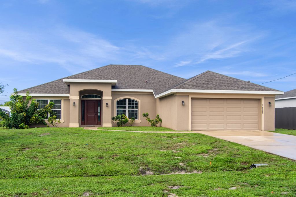 Photo of 1898 SW Monterrey Lane, Port Saint Lucie, FL 34953 (MLS # R11126905)