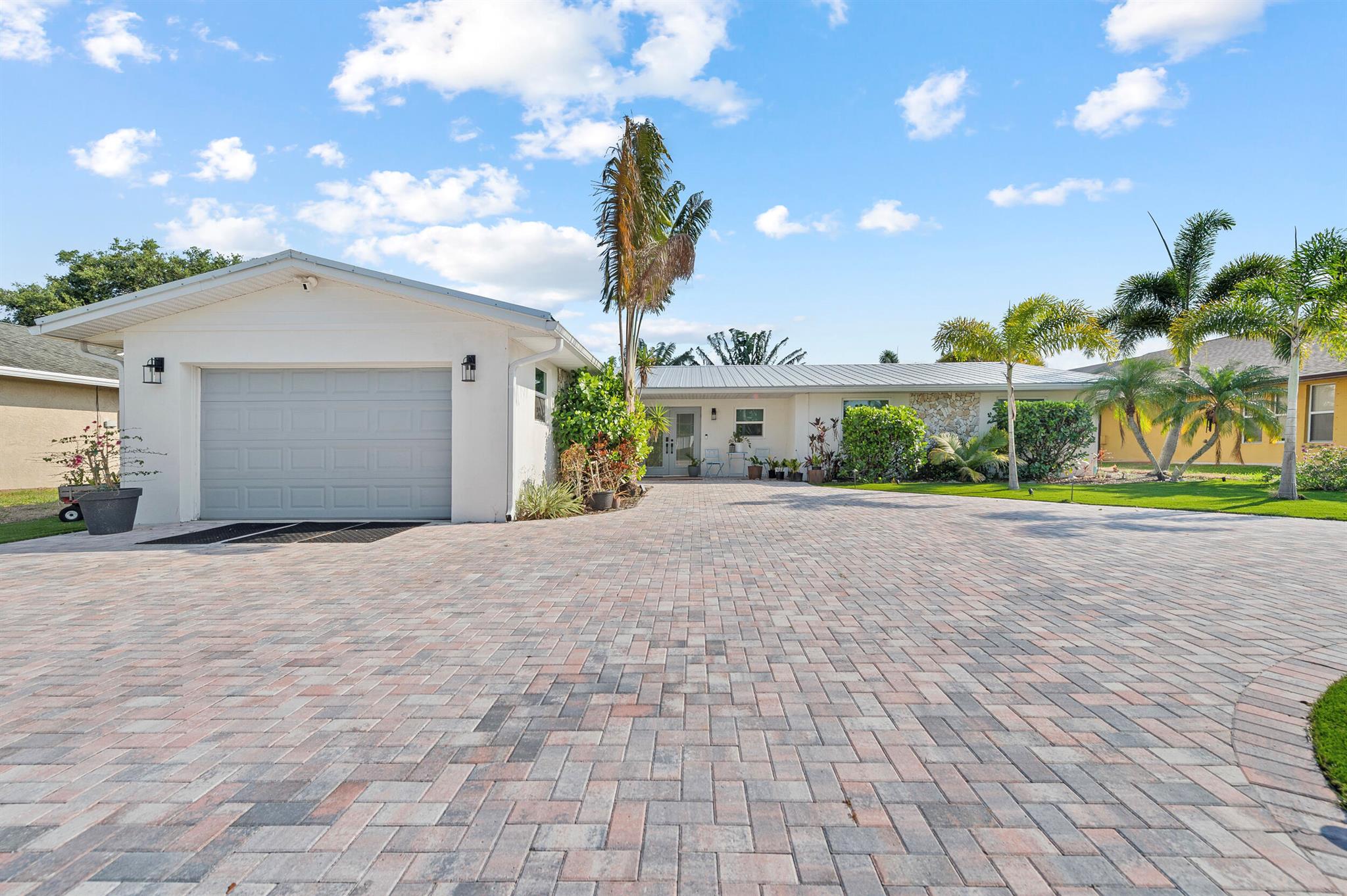 Experience Port Saint Lucie's waterfront living at it's finest. Best value for this completely renovated screened-in pool home with 2 boat spaces and 1 lift for a boat up to 36 ft! Here you can enjoy boating with ease and you're only 30 minutes to the inlet! The home offers 3 bedrooms, 3 baths, and a 1-car garage with an extended driveway. The kitchen is equipped with granite countertops and stainless steel appliances. Enjoy the open concept living/dining area overlooking the private pool and large patio, or take in the stunning riverfront views. This is a hurricane ready home with impact windows and doors throughout and a recently replaced metal roof! This turnkey home is fully furnished with the option of being unfurnished with an annual lease.