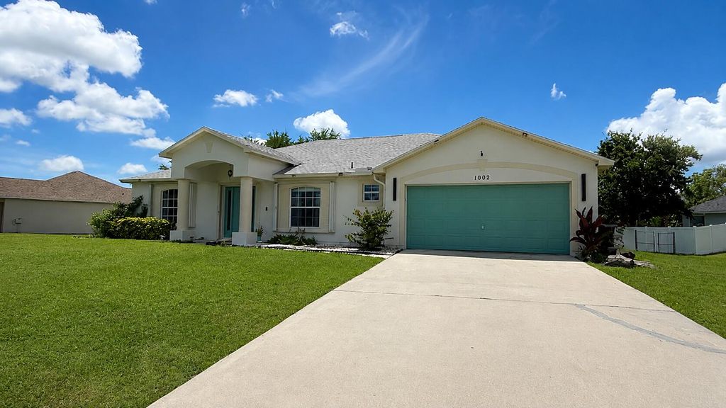 Photo of 1002 SW Longfellow Road, Port Saint Lucie, FL 34953 (MLS # B26034517)