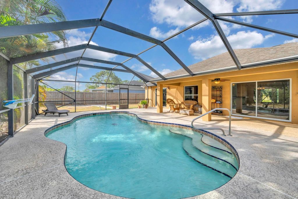 Photo of 214 SW Milburn Circle, Port Saint Lucie, FL 34953 (MLS # R11077873)