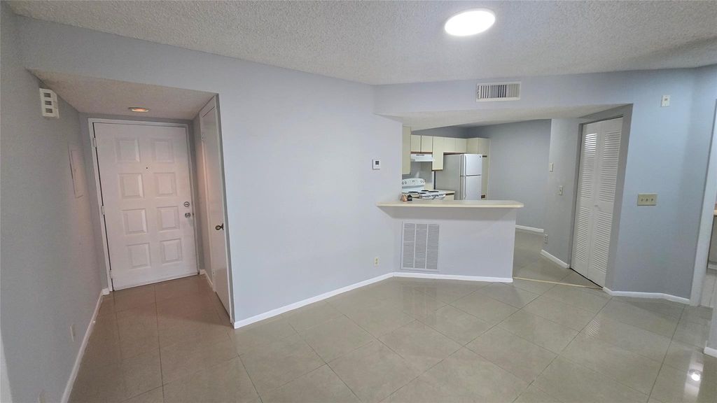 Photo of 9055 Wiles Rd #5-106, Coral Springs, FL 33067 (MLS # F10528292)