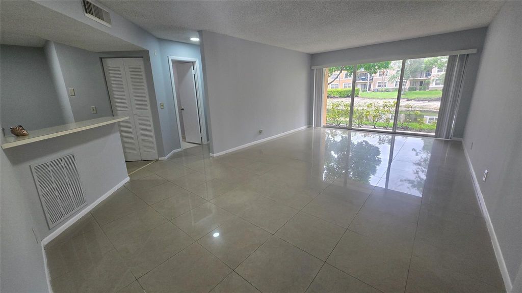 Photo of 9055 Wiles Rd #5-106, Coral Springs, FL 33067 (MLS # F10528292)