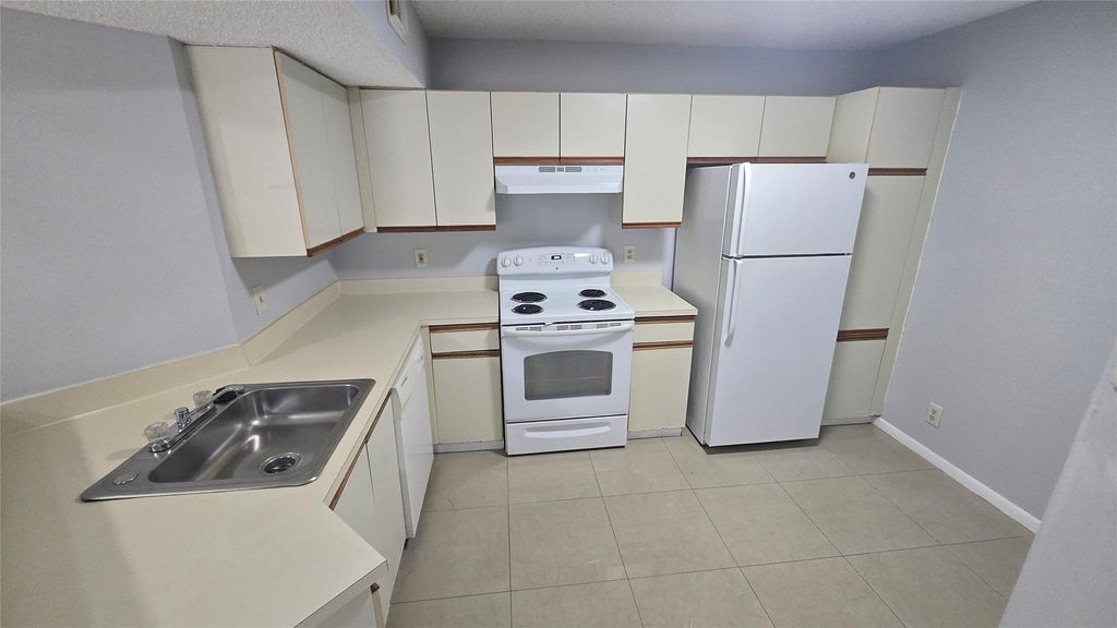 Photo of 9055 Wiles Rd #5-106, Coral Springs, FL 33067 (MLS # F10528292)