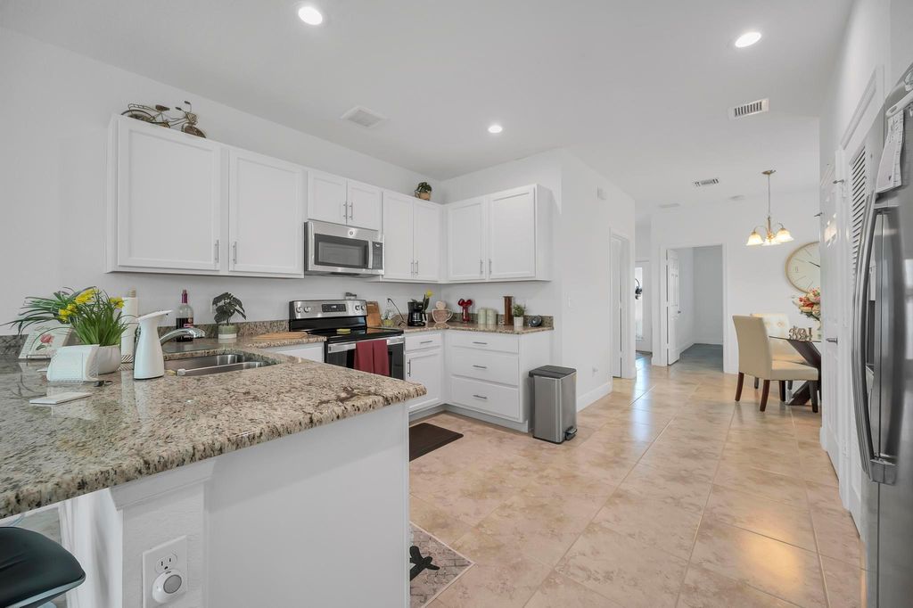 Photo of 899 NE Trailside, Port Saint Lucie, FL 34983 (MLS # R11032720)