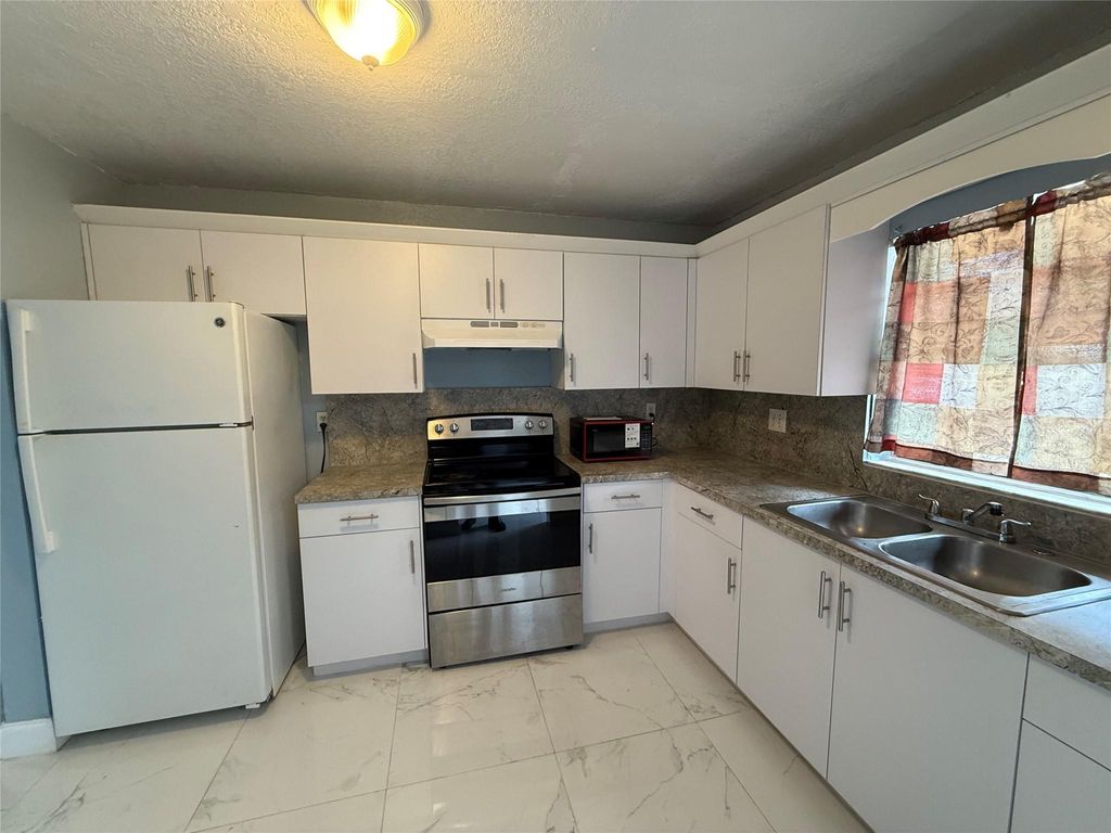 Photo of 1751 SW 40th Terrace #A, Fort Lauderdale, FL 33317 (MLS # F10494561)