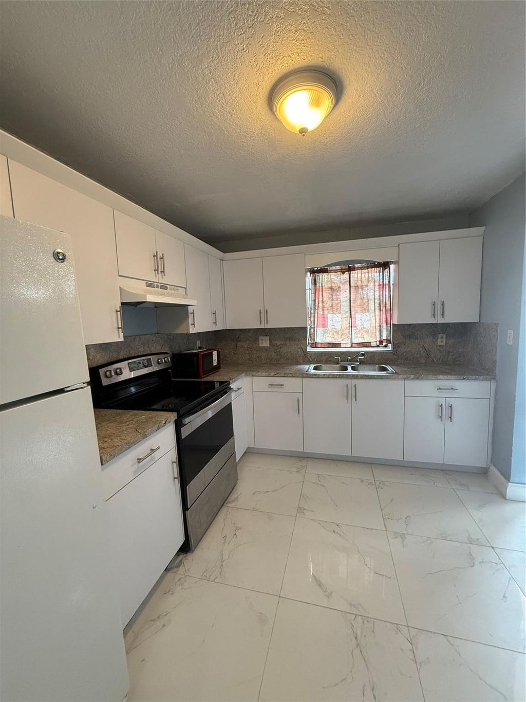 Photo of 1751 SW 40th Terrace #A, Fort Lauderdale, FL 33317 (MLS # F10494561)
