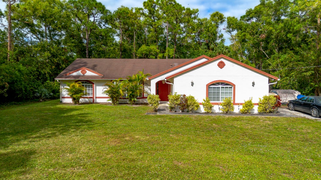 Photo of 11449 61st Street N, The Acreage, FL 33412 (MLS # R11037832)