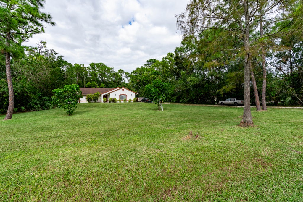 Photo of 11449 61st Street N, The Acreage, FL 33412 (MLS # R11037832)