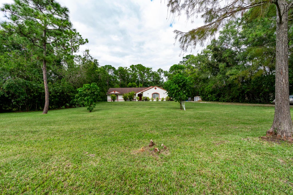 Photo of 11449 61st Street N, The Acreage, FL 33412 (MLS # R11037832)