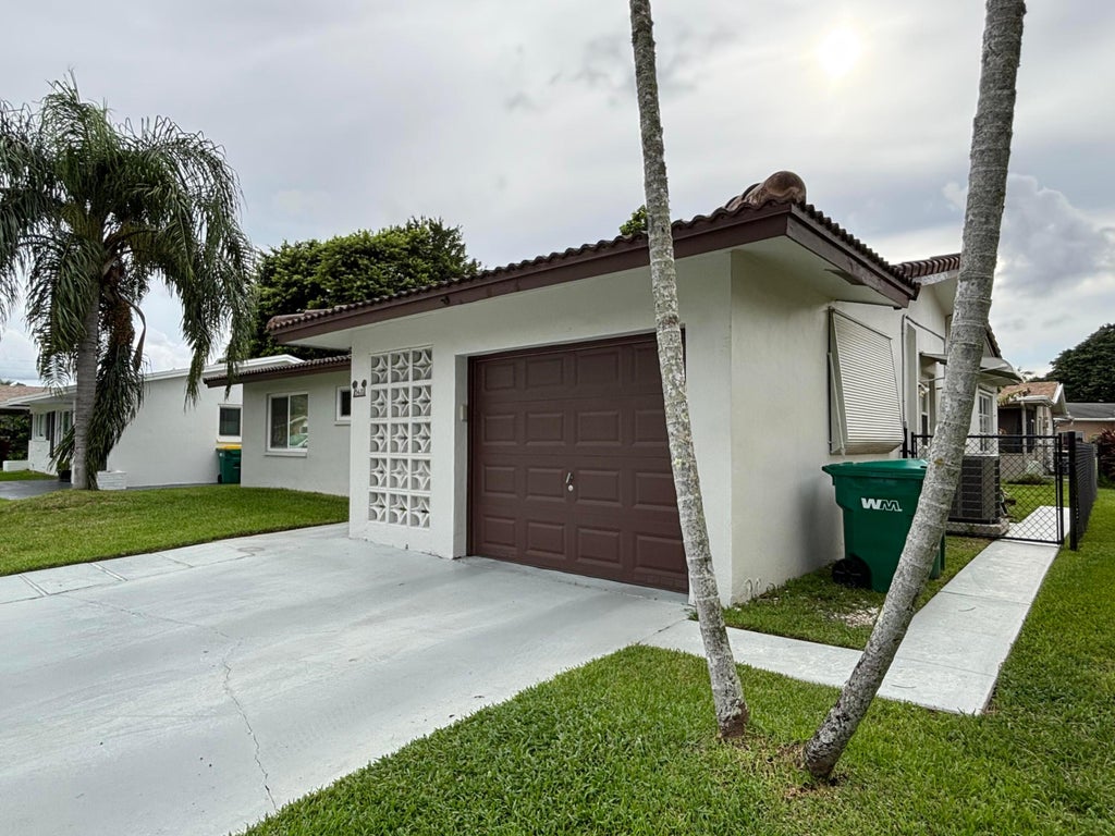 Photo of 5611 NW 49TH Terrace, Tamarac, FL 33319 (MLS # B26079613)